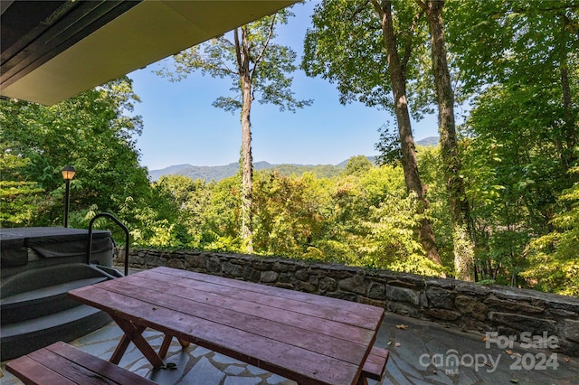 wooden terrace featuring a mountain view