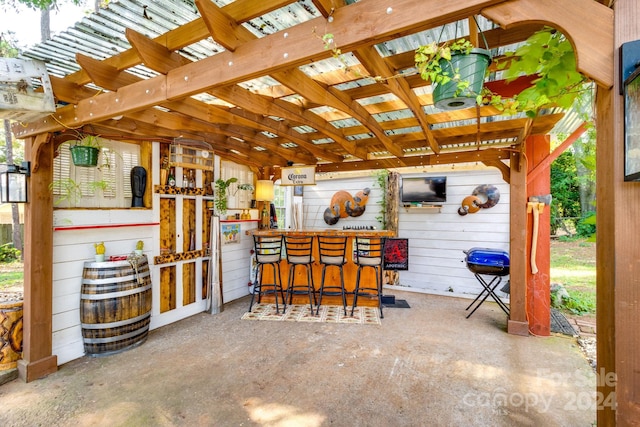 view of patio featuring grilling area and a pergola