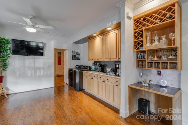 kitchen featuring decorative backsplash, ornamental molding, ceiling fan, and light hardwood / wood-style flooring