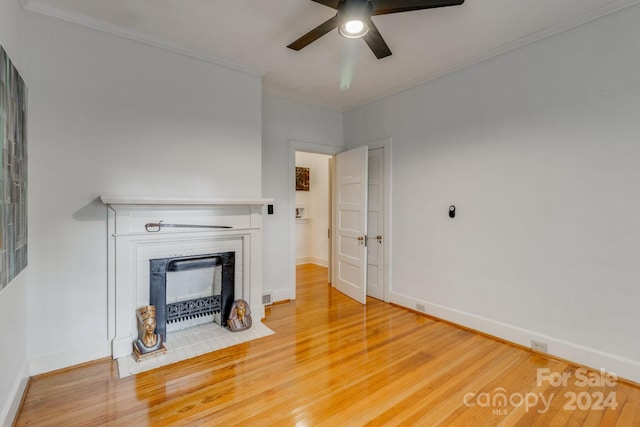 unfurnished living room with ornamental molding, ceiling fan, and hardwood / wood-style floors