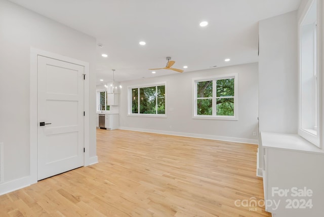345 Riverview Dr, Asheville, NC 28806 - empty room featuring recessed lighting, ceiling fan with notable chandelier, baseboards, and light wood-style floors