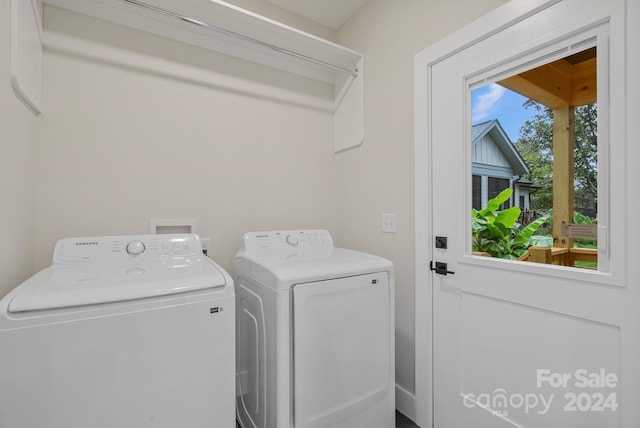 washroom featuring washer and clothes dryer