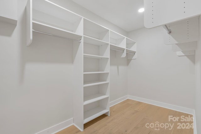 walk in closet featuring hardwood / wood-style floors