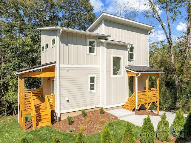 345 Riverview Dr, Asheville, NC 28806 - rear view of property featuring stairs and board and batten siding