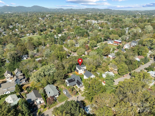 birds eye view of property featuring a mountain view