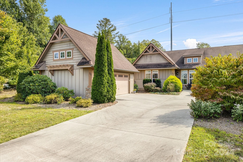 craftsman house with a garage