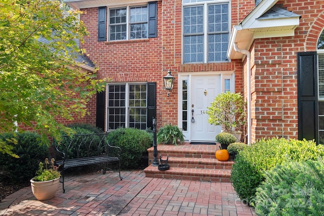 entrance to property with a patio area