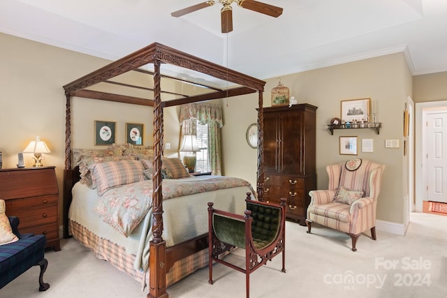 carpeted bedroom with ceiling fan and ornamental molding