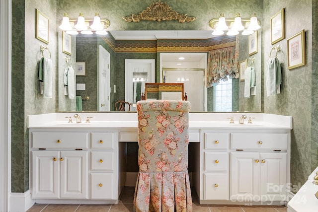 bathroom with a shower with shower door, tile patterned flooring, ornamental molding, and vanity