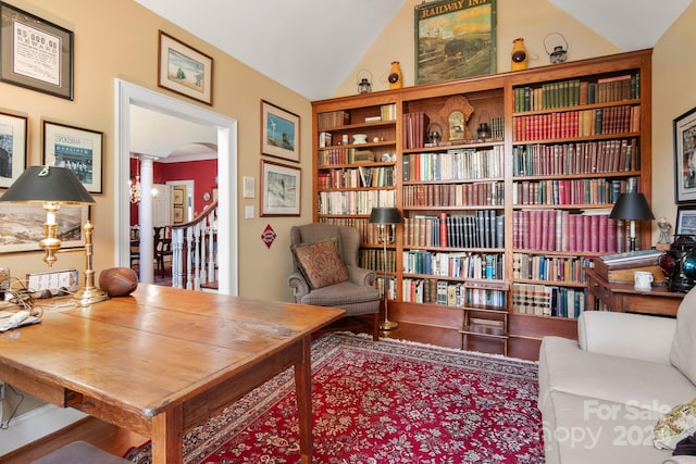 home office featuring lofted ceiling and hardwood / wood-style floors