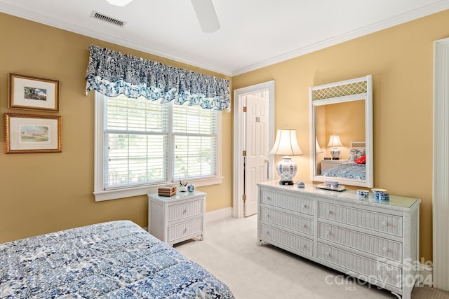 bedroom featuring ceiling fan, crown molding, and light carpet