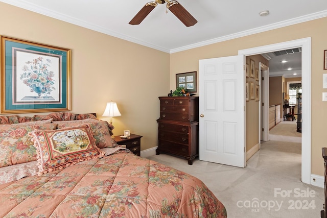 carpeted bedroom with ceiling fan and crown molding