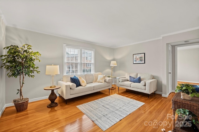 living room featuring hardwood / wood-style flooring and ornamental molding