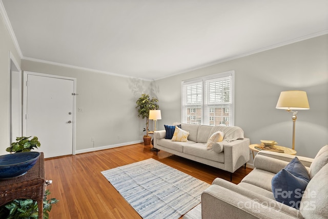 living room featuring wood-type flooring and ornamental molding