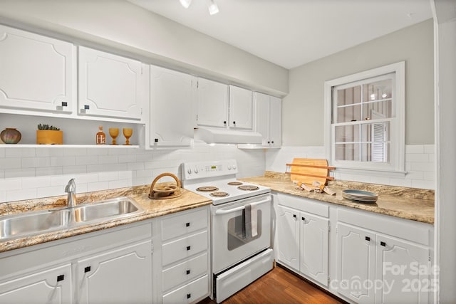 kitchen featuring dark hardwood / wood-style floors, sink, white cabinets, decorative backsplash, and electric range