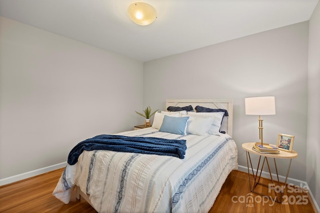 bedroom featuring dark hardwood / wood-style floors