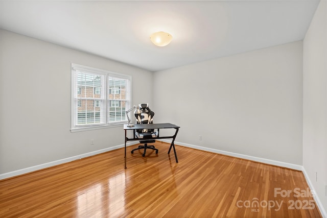 unfurnished office featuring hardwood / wood-style flooring