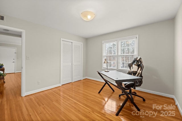 office space with hardwood / wood-style flooring