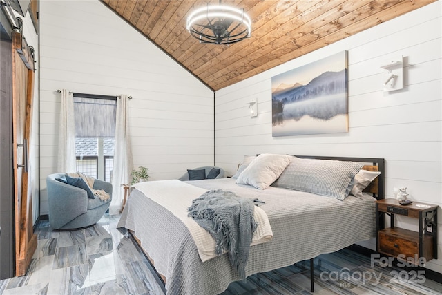 bedroom featuring vaulted ceiling, a barn door, wooden ceiling, and wood walls