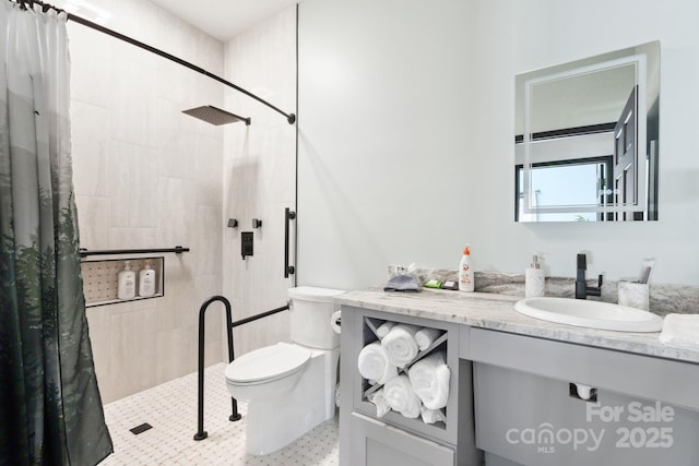 bathroom featuring vanity, toilet, and a shower with shower curtain