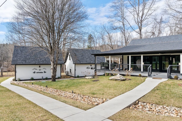 rear view of property with a lawn and covered porch