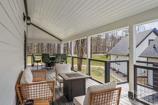 sunroom / solarium featuring wooden ceiling