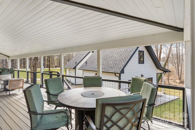 sunroom / solarium featuring plenty of natural light, lofted ceiling with beams, and wooden ceiling