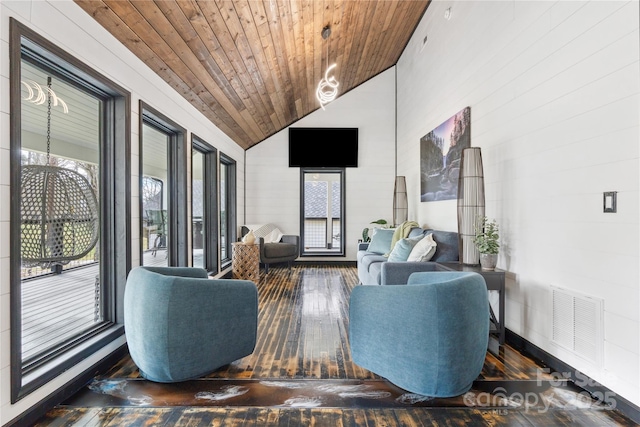 interior space featuring dark hardwood / wood-style flooring, high vaulted ceiling, and wood ceiling