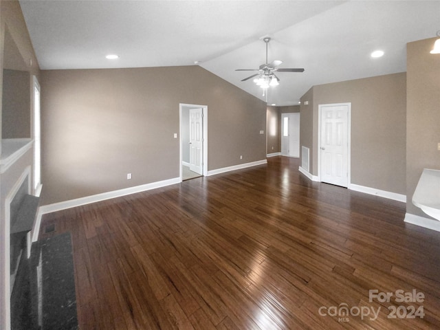 unfurnished living room featuring dark wood-type flooring, ceiling fan, and vaulted ceiling