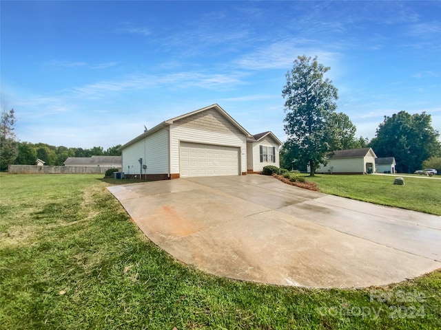 view of front of house featuring a garage and a front lawn