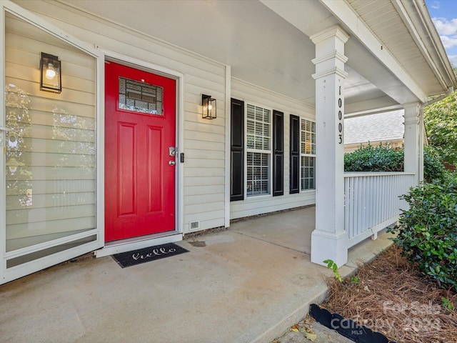 property entrance with covered porch