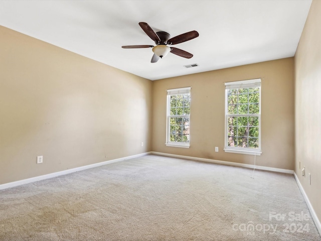 carpeted empty room with ceiling fan