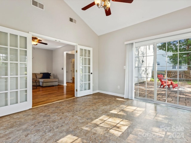 unfurnished room featuring french doors, hardwood / wood-style flooring, high vaulted ceiling, and ceiling fan