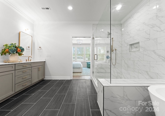 bathroom with ornamental molding, shower with separate bathtub, and vanity