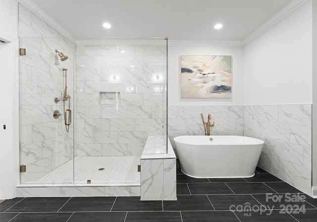 bathroom featuring tile walls, separate shower and tub, and crown molding