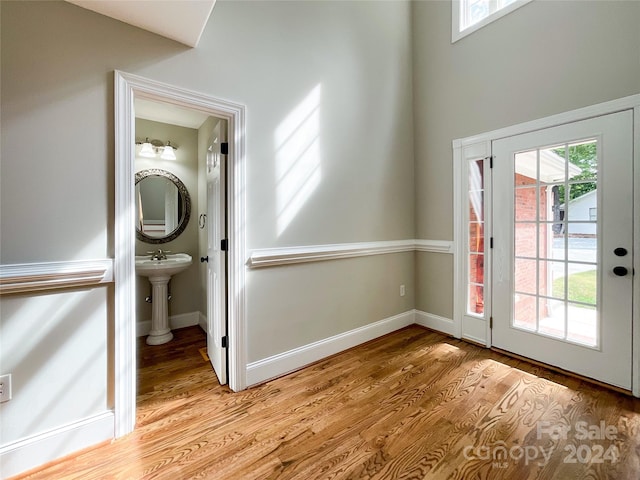 interior space featuring a wealth of natural light, sink, and hardwood / wood-style floors