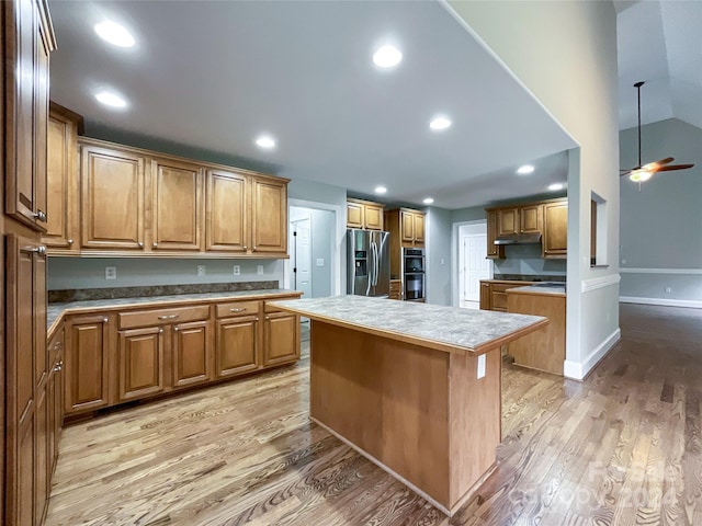 2510 Doster Rd, Monroe, NC 28112 - kitchen featuring recessed lighting, a center island, light wood-type flooring, and appliances with stainless steel finishes