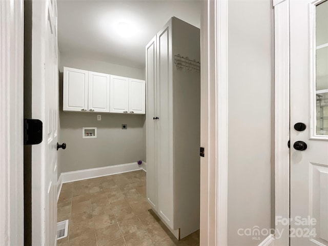 laundry area featuring hookup for a washing machine, cabinets, and electric dryer hookup