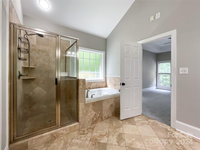 2510 Doster Rd, Monroe, NC 28112 - full bathroom with a shower stall, baseboards, vaulted ceiling, and a garden tub