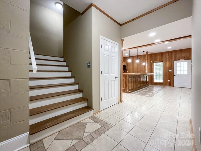 2510 Doster Rd, Monroe, NC 28112 - stairs featuring wooden walls, tile patterned floors, recessed lighting, and crown molding