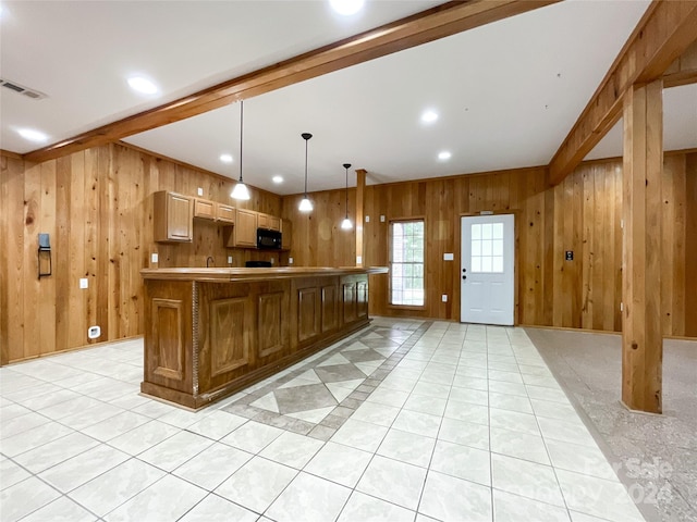 2510 Doster Rd, Monroe, NC 28112 - kitchen with black microwave, visible vents, wood walls, and beam ceiling