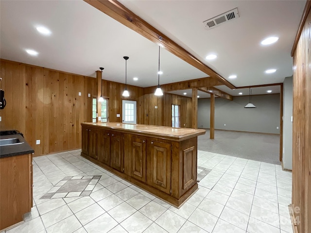 2510 Doster Rd, Monroe, NC 28112 - kitchen with wood walls, recessed lighting, a kitchen island, beam ceiling, and visible vents