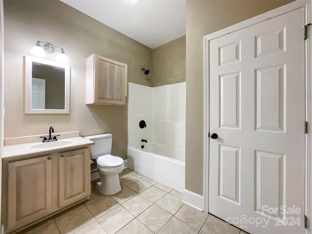 2510 Doster Rd, Monroe, NC 28112 - bathroom featuring toilet, tile patterned flooring, vanity, and bathing tub / shower combination