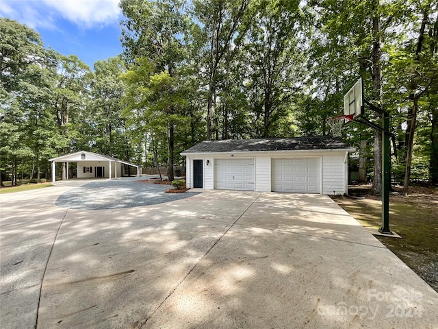 garage featuring a carport