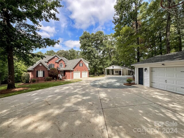 2510 Doster Rd, Monroe, NC 28112 - view of front of home featuring a front yard, a garage, and concrete driveway