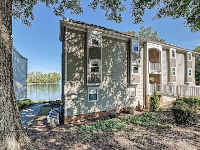 view of front of home with a water view