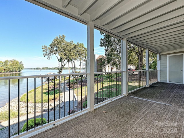 balcony featuring a water view