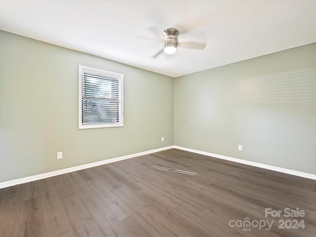 empty room featuring hardwood / wood-style floors and ceiling fan