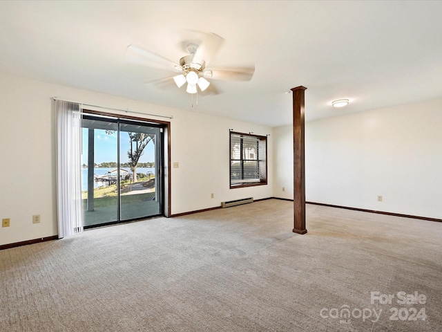 unfurnished room featuring ceiling fan, a baseboard radiator, light carpet, and decorative columns