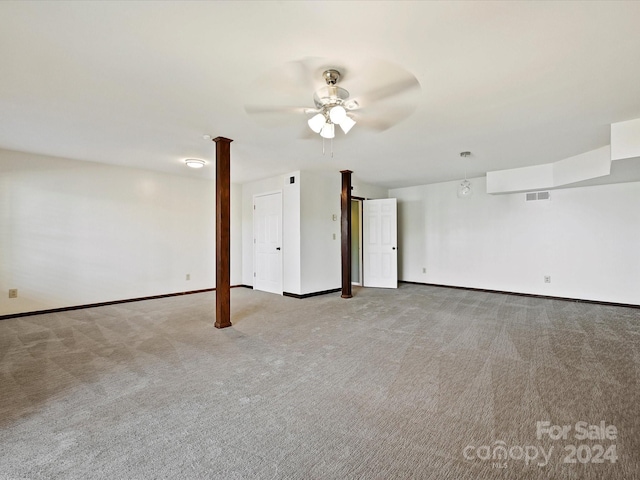 carpeted spare room with ceiling fan